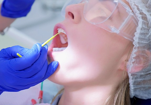 Patient receiving fluoride treatment