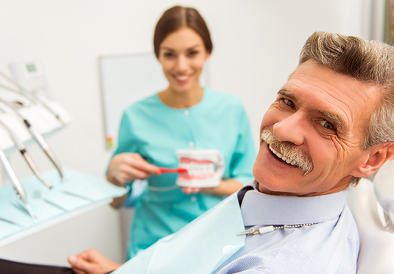 Man smiling after cost of dentures in Lewisville