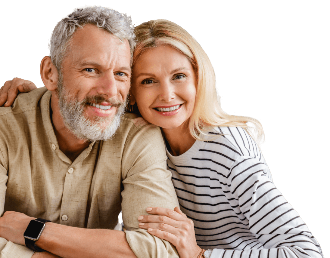 Man and woman smiling and hugging from the side