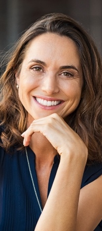Woman in dark blue blouse smiling