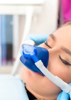 A woman receiving nitrous oxide sedation