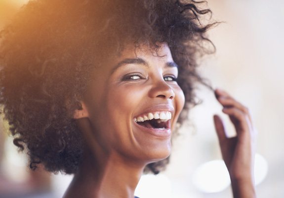 Closeup of woman smiling outside