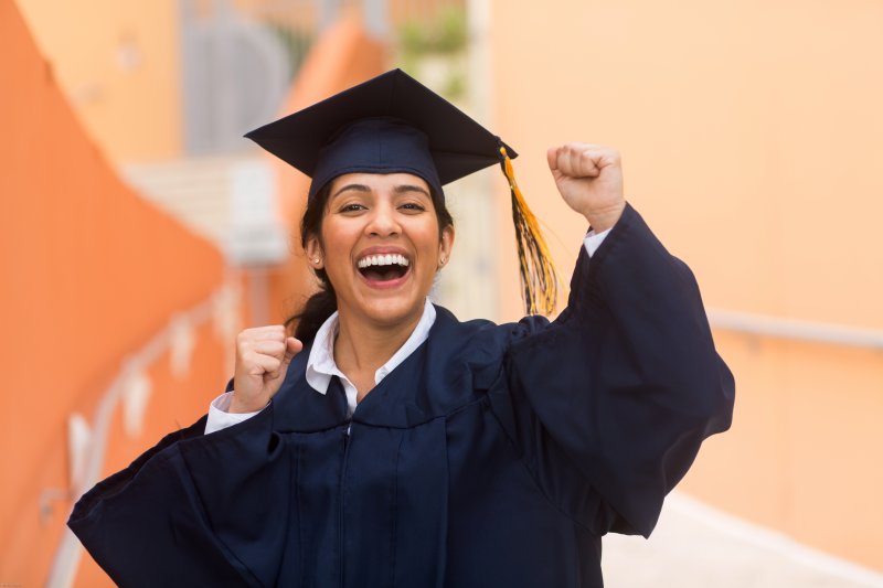young woman smiling after graduating