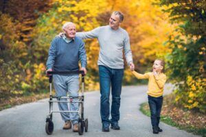 Three generations of a family walking outdoors 